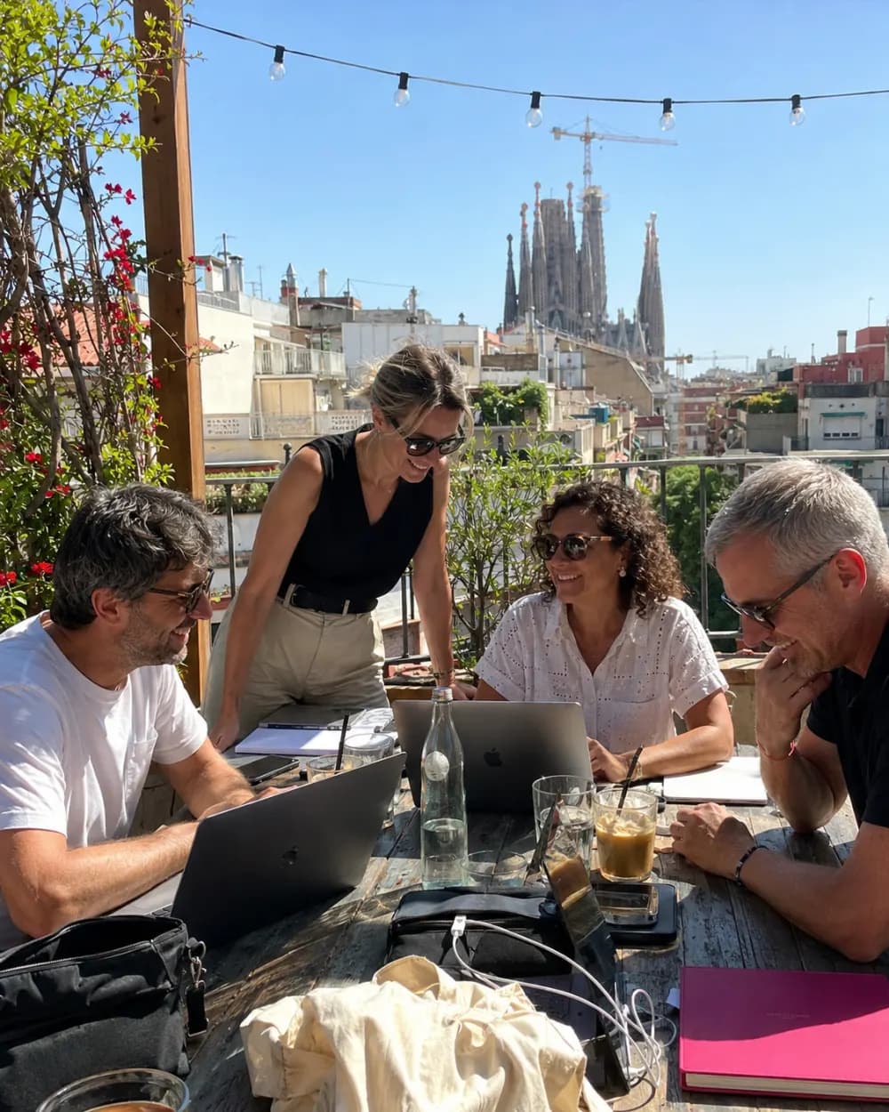 The Teamed team working together on a Barcelona rooftop
